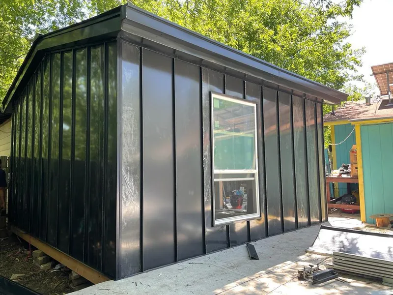 Black standing seam metal wall panels for Roof Inspection in Tonawanda